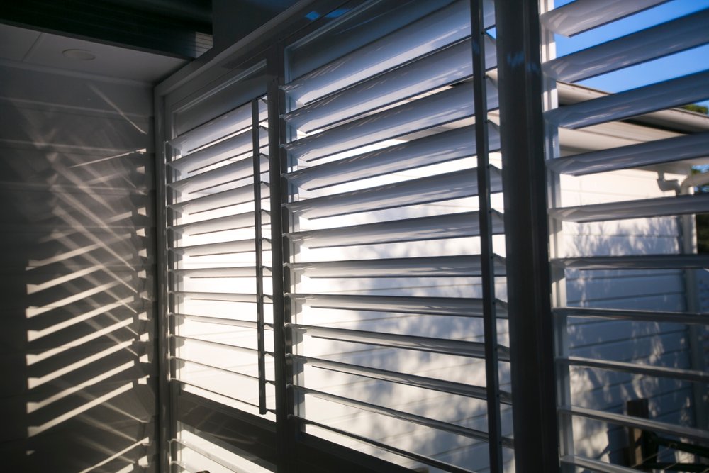 Triple outdoor white windows aluminium louver shutter at the house back yard sun room